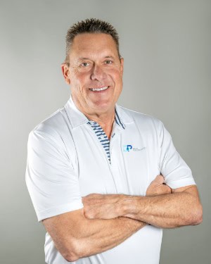 Shawn Hays wearing a white company shirt.